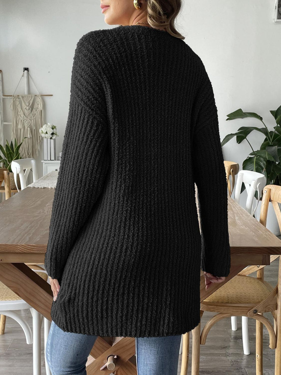 Black textured bouclé open-front cardigan with long sleeves and a relaxed fit.