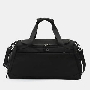 Black duffel gym bag with dual handles and a detachable shoulder strap