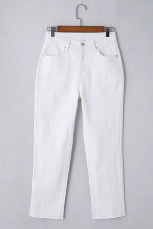 White cotton high-waisted straight leg jeans with ankle length and layered hem detail