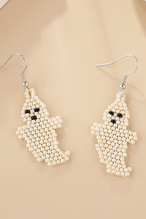 Ivory beaded ghost fringe earrings with black bead eyes