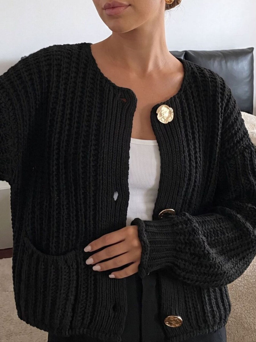 cream cardigan featuring buttoned and ribbed knit