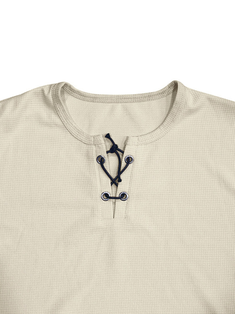 Apricot cotton t-shirt with V-neck lace-up detail and dark blue ties.