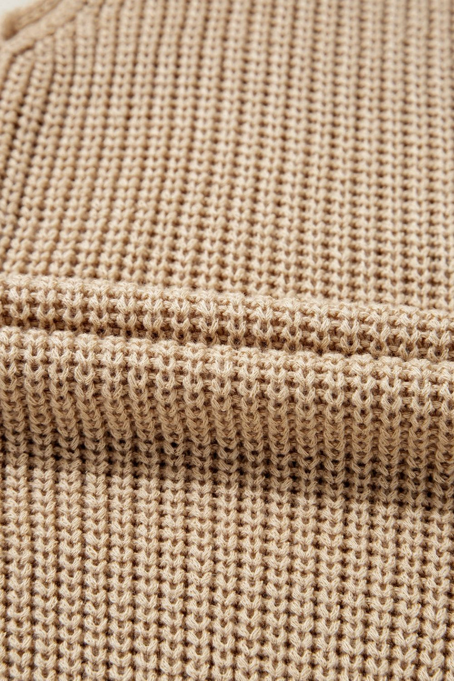 Tan knit tank top with a textured waffle stitch pattern.