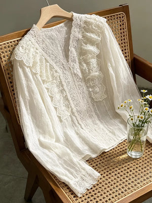 Apricot blouse featuring lace and polka dot