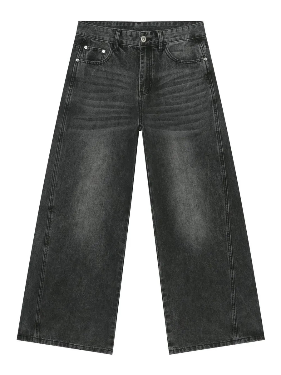 Dark wash denim trousers with exaggerated wide legs and a casual fit.