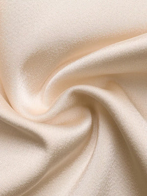 Champagne satin fabric with a subtle sheen and diagonal weave detail.