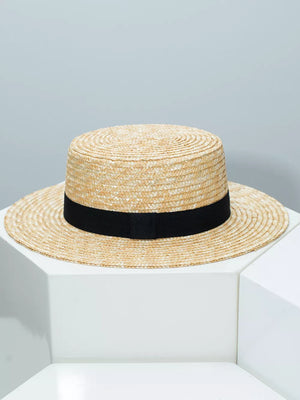 Women's straw boater hat with black ribbon band