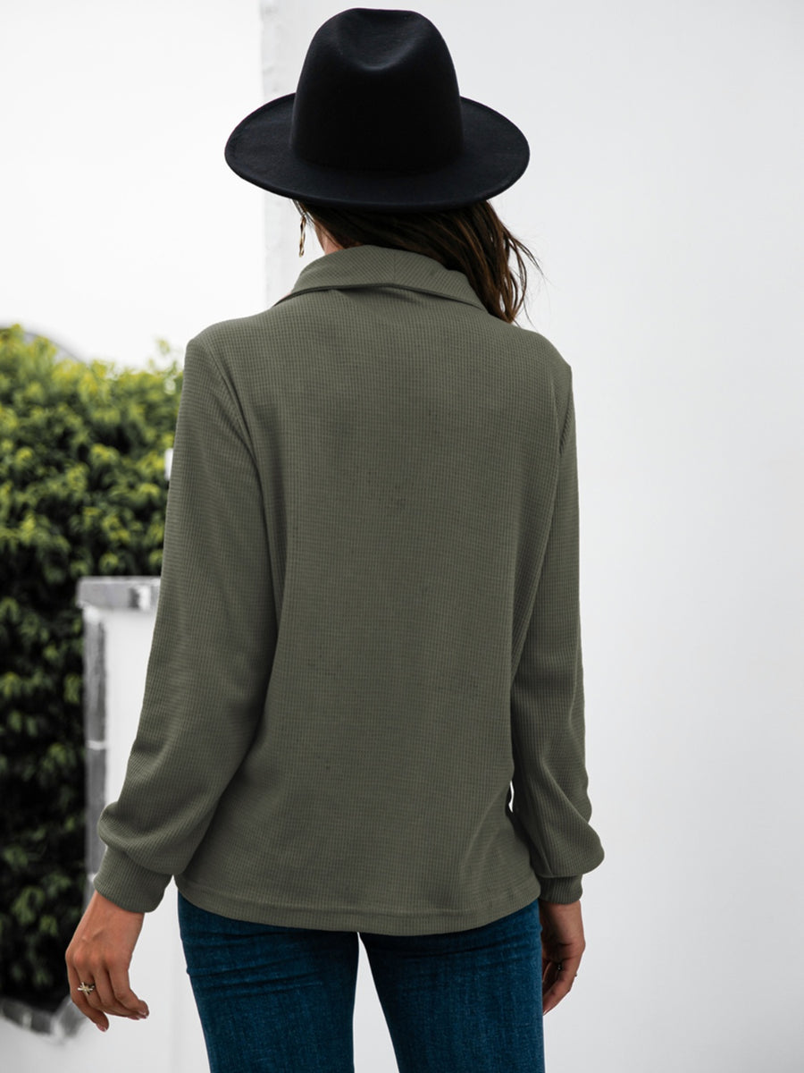 Army green waffle knit long sleeve tee with collar and button detail.