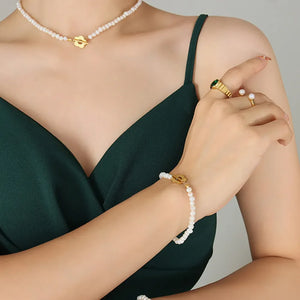 Pearl Petal Pearl Bracelet in gold with toggle clasp, styled on a model.