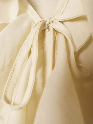 Beige relaxed blouse with v-neck