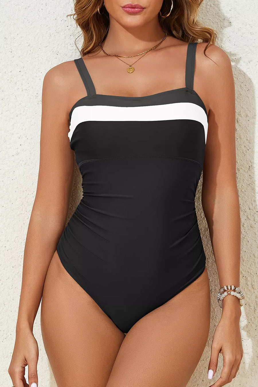 Black one-piece swimsuit with removable padding and sleeveless