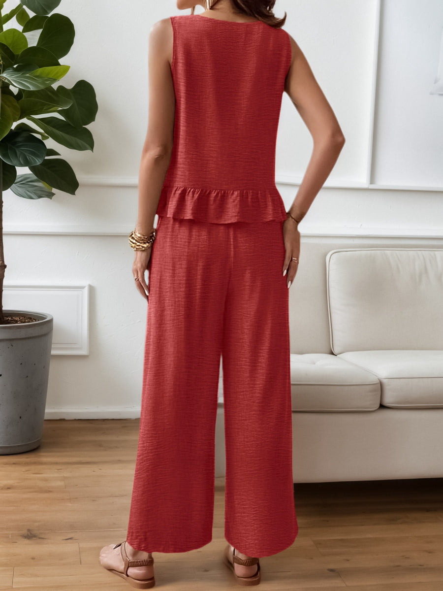 Red ruffled hem sleeveless top and wide-leg pants set with textured fabric.