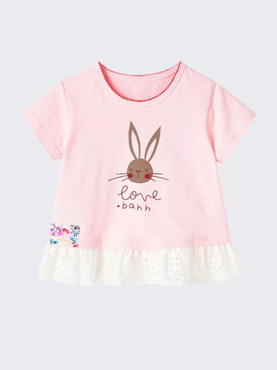 Pink cotton baby tee with bunny graphic, ruffles, and floral patch.