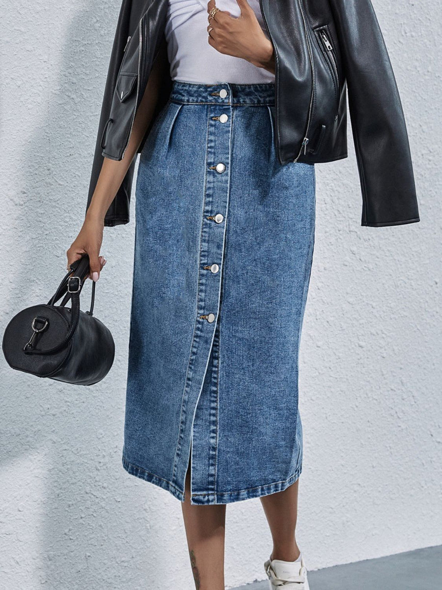 Button-front denim midi skirt in light wash with pleats and a front slit.