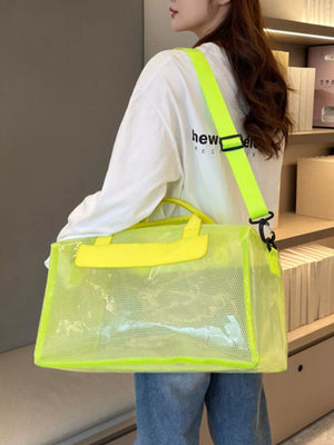Chic transparent PVC travel bag in fluorescent green with mesh detail and yellow accents.