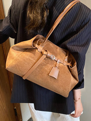 shoulder bag in black with buckle detail and medium