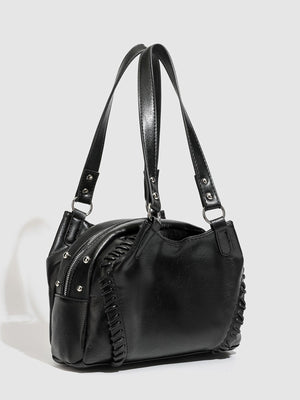 shoulder bag in black featuring woven detail and boxy fit