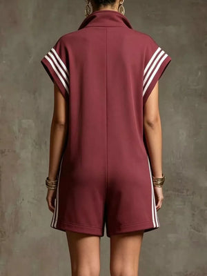 Burgundy sporty zip-up romper with white stripes on sleeves and sides.