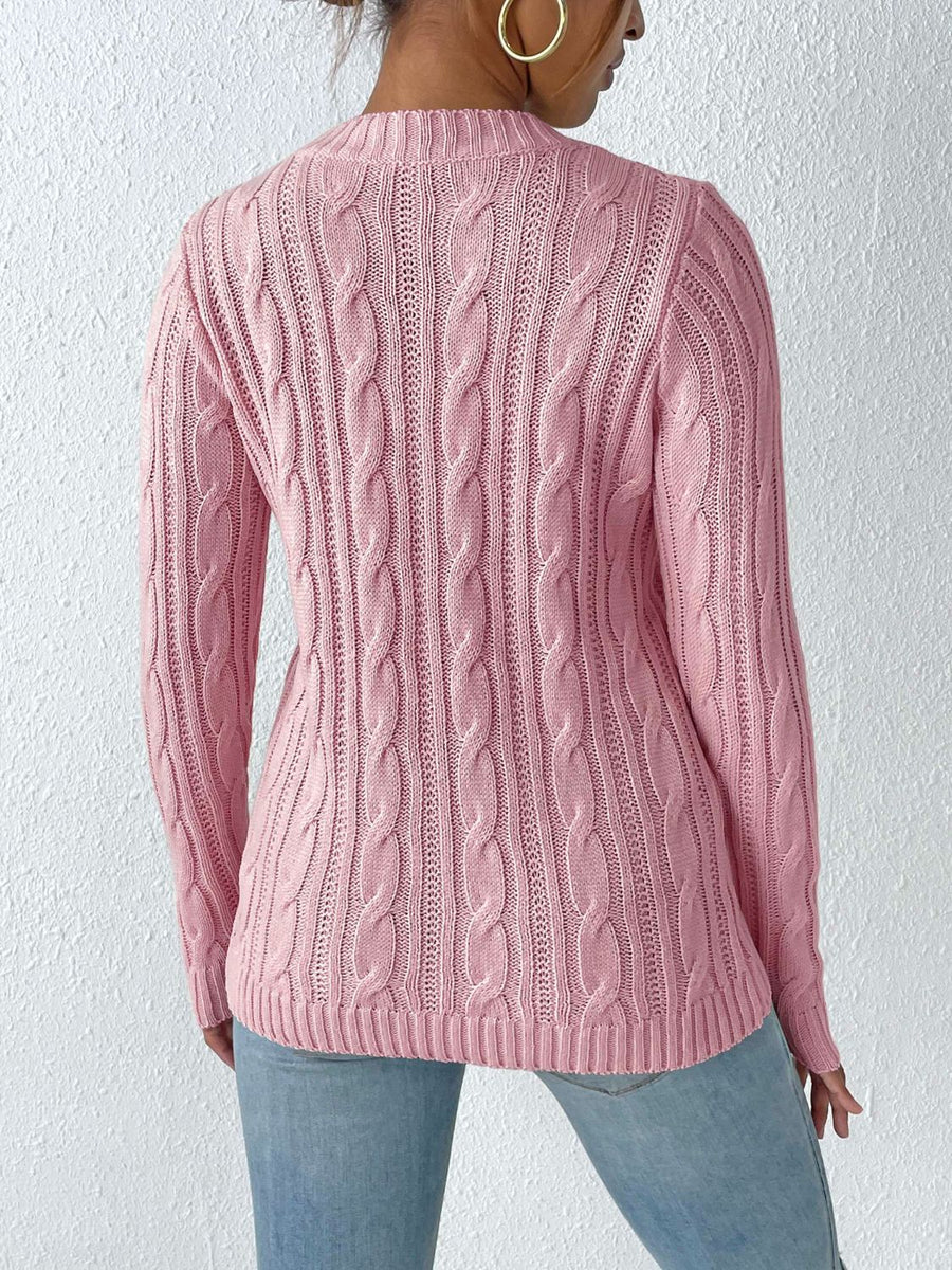 Dusty Pink cable knit mock neck sweater with textured knit details.