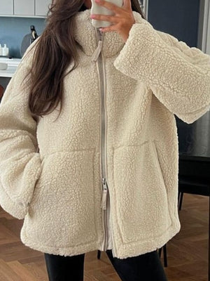 sherpa jacket in cream featuring zipper and relaxed fit