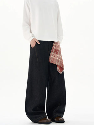 Black wide-leg jeans with red plaid scarf detail, cotton denim.