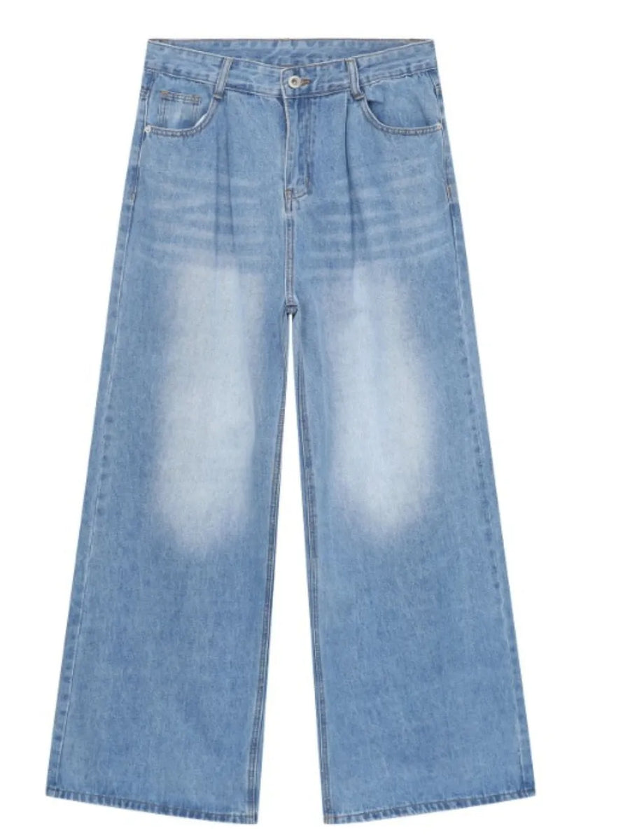 Light blue denim palazzo jeans with pleats and a wide leg.