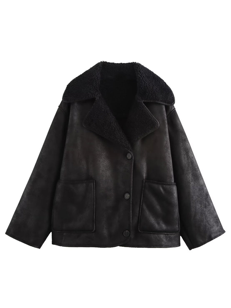 Black aviator jacket with shearling trim and button closure.