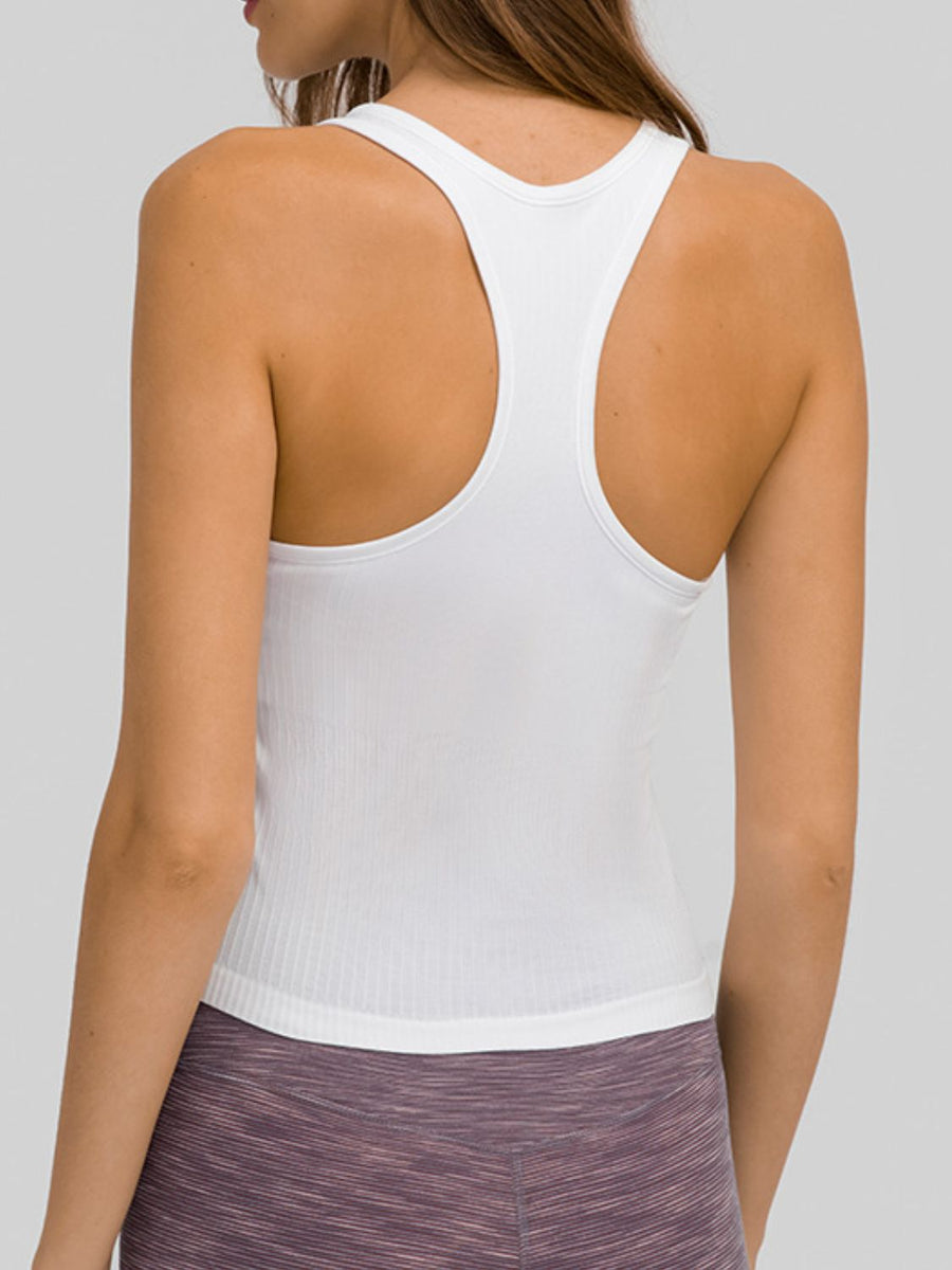 White ribbed racerback tank top with a fitted silhouette.