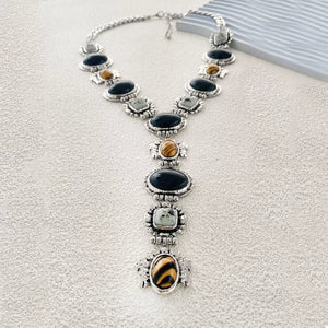 Resin, Zinc alloy, Silver-plated Care instructions: Avoid wearing during exercis necklace in brown with straight silhouette