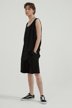 Black sleeveless tank top and shorts with raw hem