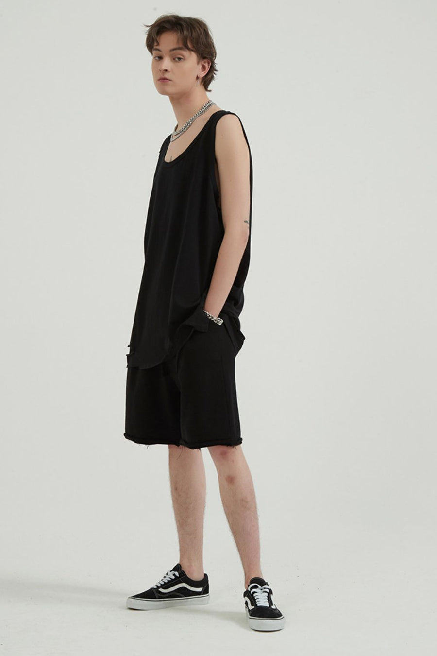 Black sleeveless tank top and shorts with raw hem