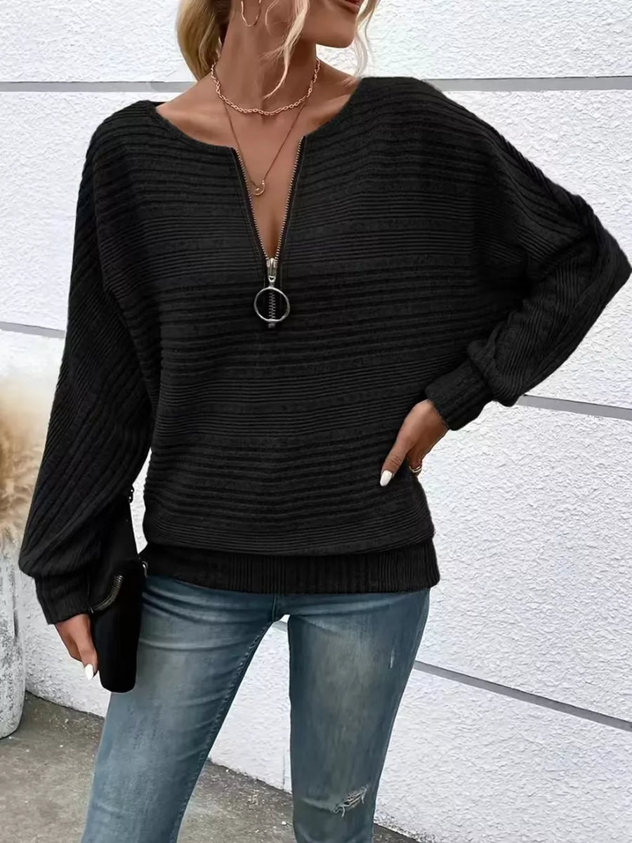 Black ribbed acrylic quarter zip sweatshirt with O-ring pull and dolman sleeves.