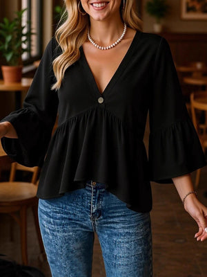 Black V-neck blouse with flounce sleeves and a single button detail.