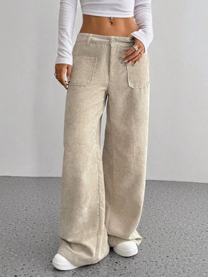 Apricot corduroy wide-leg trousers with front pockets and a comfortable fit.