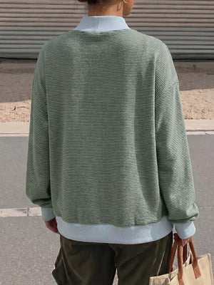 95% polyester, 5% elastane Care instructions: Machine wash cold sweatshirt in Blue with relaxed silhouette