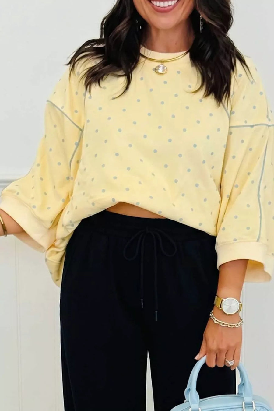 light blue sweatshirt featuring contrast stitching and polka dot