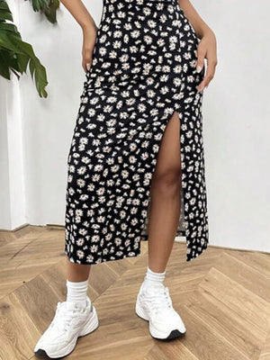 Black Flower spaghetti strap midi dress with a high slit and daisy print.