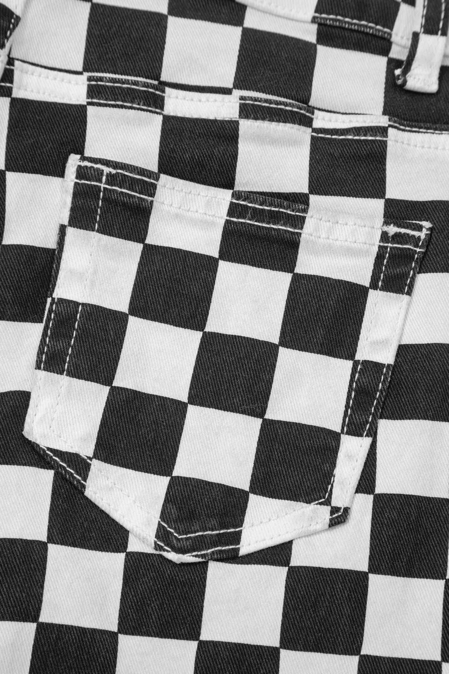 Checkerboard distressed cropped jeans in black and white denim with a back pocket detail.