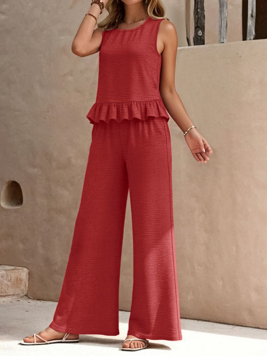 Red ruffled hem sleeveless top and wide leg pants set with textured fabric.