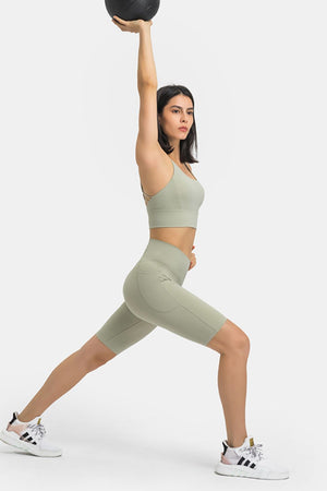 Sage V-Waist pocketed biker shorts with a high-rise fit and side pockets.