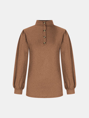 Camel button-back mock neck top with puff sleeves and textured fabric.