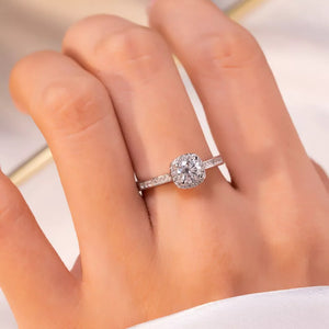 ring in silver featuring halo setting and straight fit