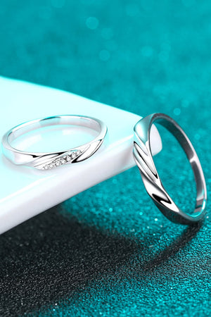 Twisted embrace silver ring set with cubic zirconia accents, 925 sterling silver.