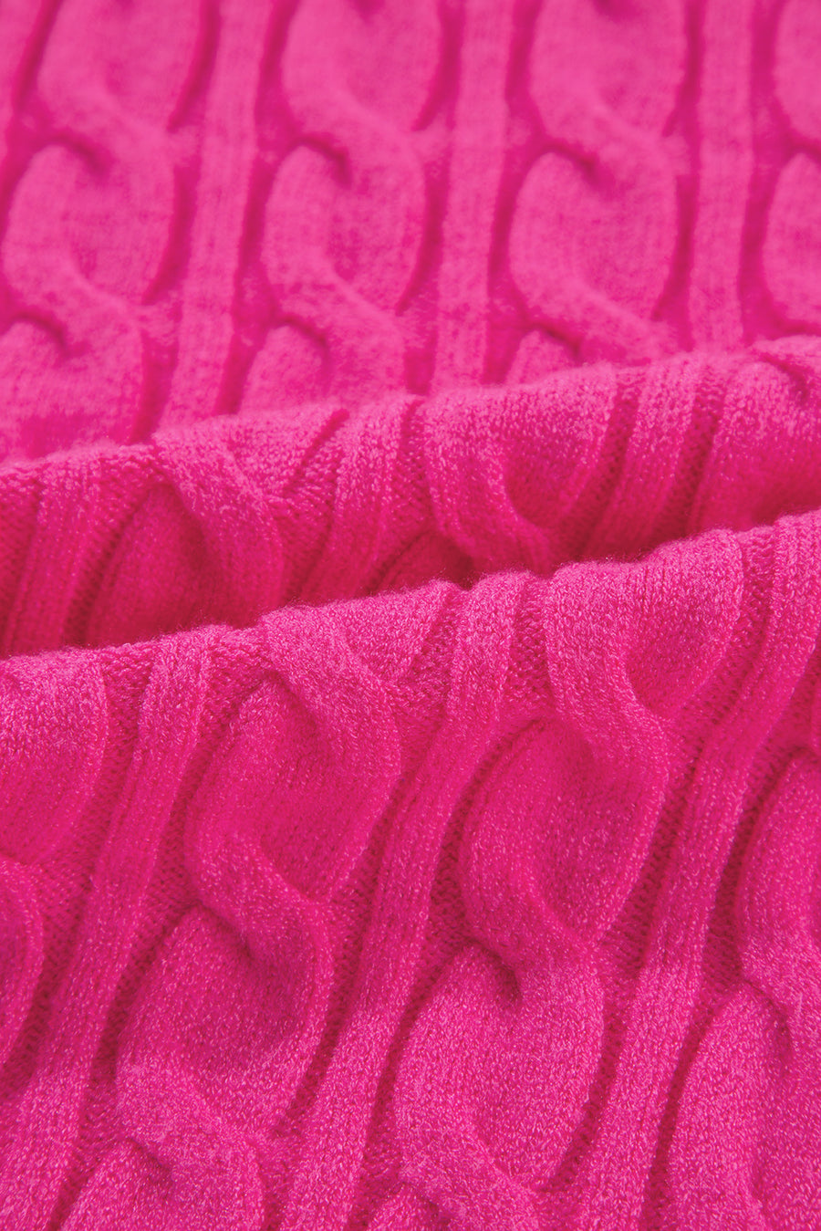 Hot pink cable knit sweater with a mock neck detail.