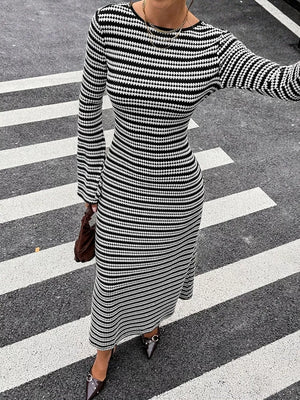 white sweater dress featuring flared sleeves and striped