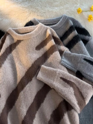 Oversized fuzzy knit pullover sweater in khaki with brown stripes and a grey option with black stripes.
