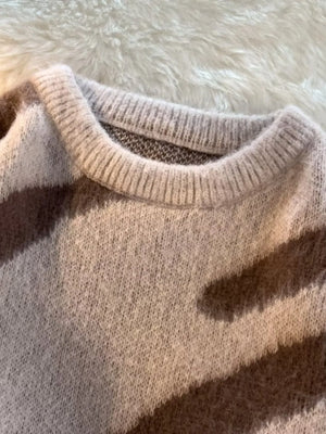 Oversized fuzzy knit pullover sweater in khaki with crew neck and ribbed trim.