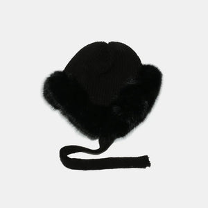 Black acrylic trapper hat with faux fur trim and tie straps.