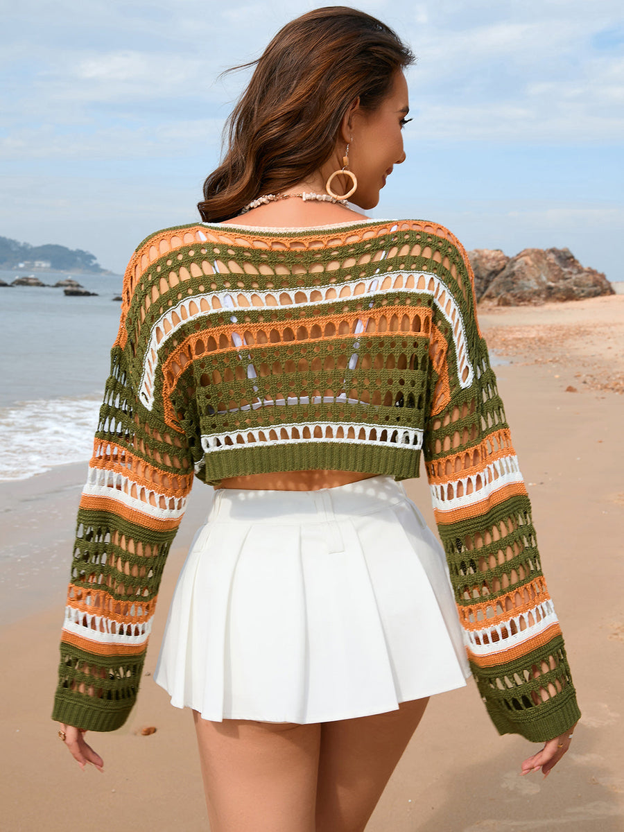 Open-knit cropped beach sweater in green, orange, and white stripes.