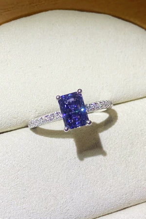 Radiant emerald-cut sapphire ring in 925 sterling silver with pave diamond band.